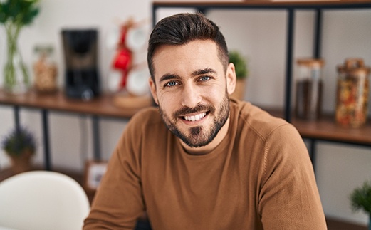 a man smiling with dental bridges in Monroe