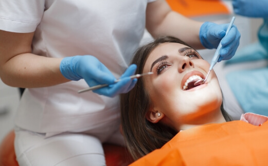 Patient receiving oral cancer screening