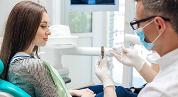 Dentist discussing dental implants with a patient