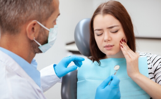 Woman receiving emergency dentistry treatment