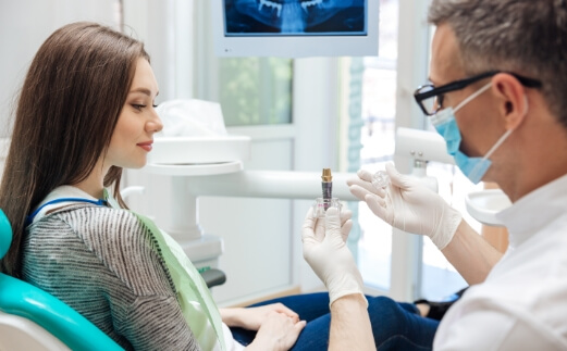 Dentist explaining the dental implant process