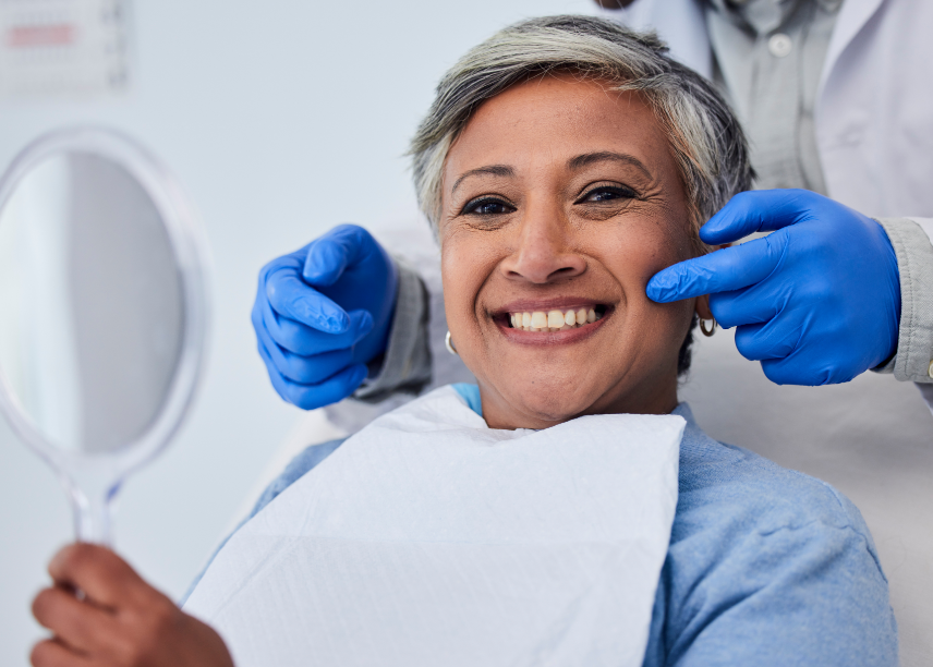 Older woman smiling in dental chair